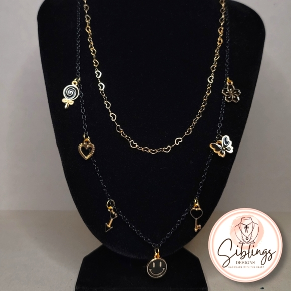 Jewelry - Necklace with black and golden charms